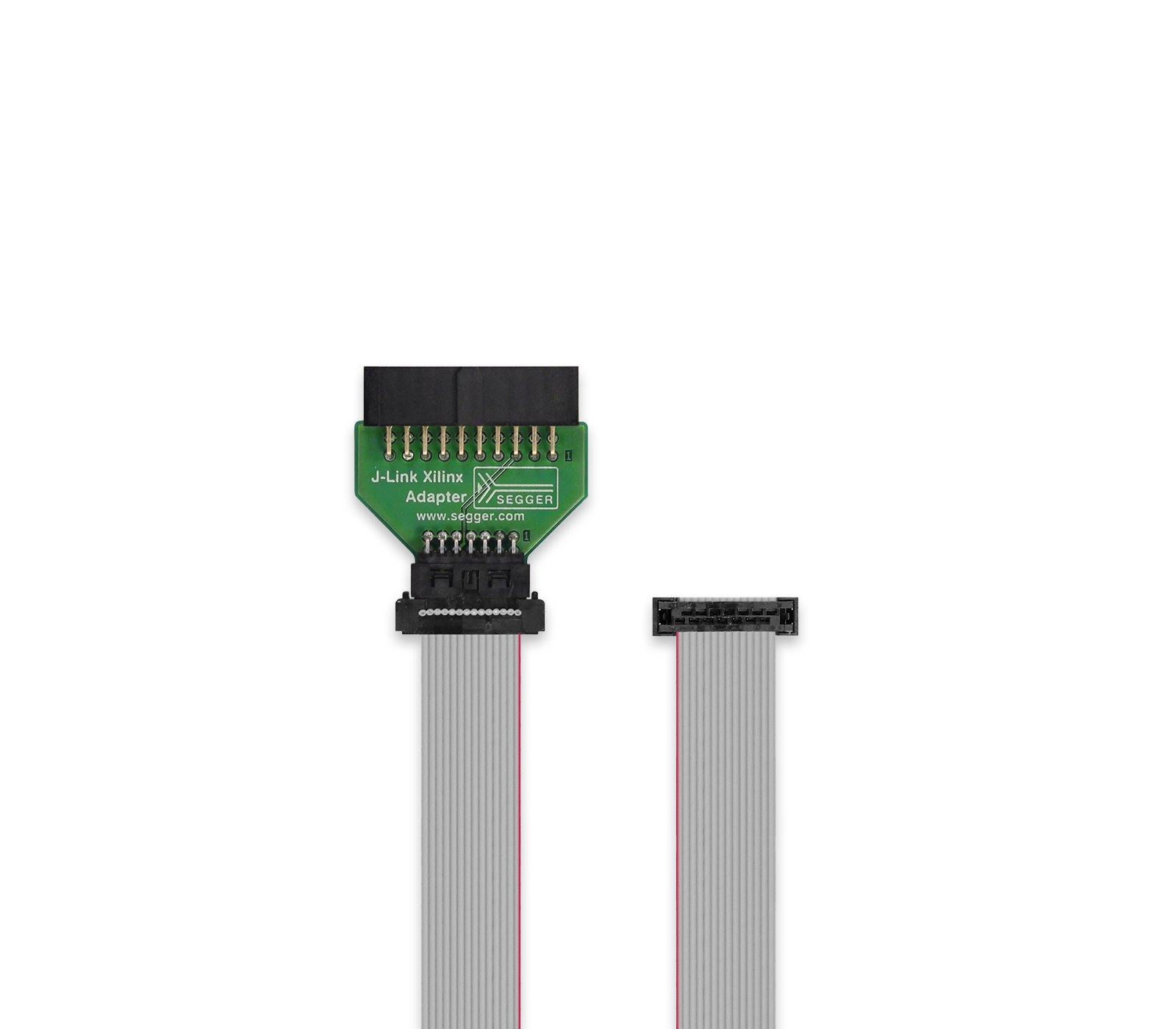 The image features a J-Link Xilinx adapter, a small, green circuit board with pins for connection on one end and a flat ribbon cable extending from the other. The adapter is used for programming and debugging in electronics projects.