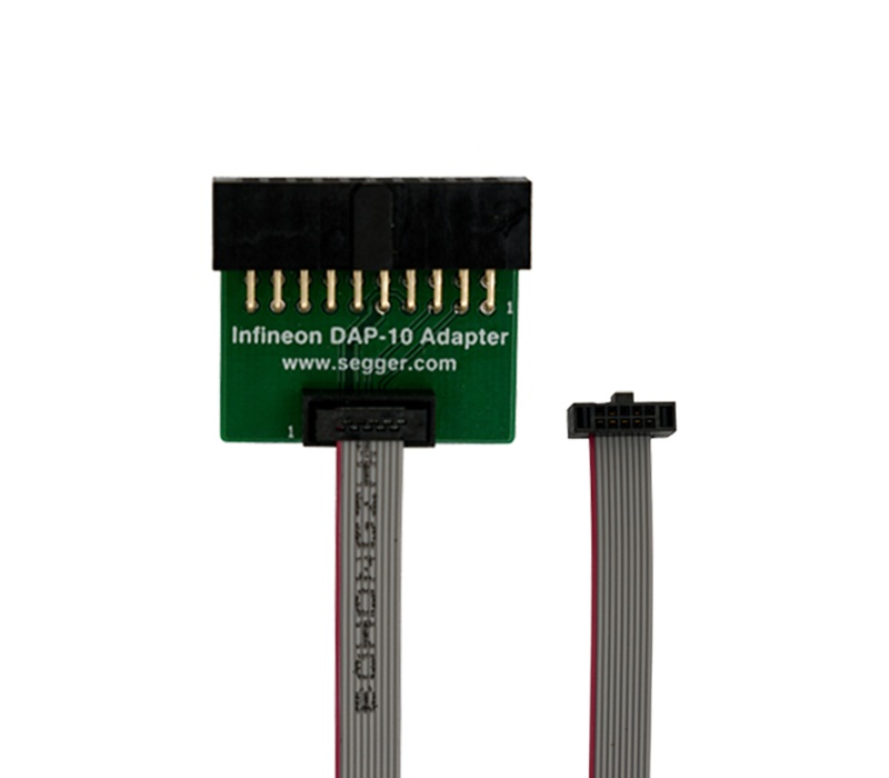 Image of an Infineon DAP-10 Adapter, featuring a rectangular green circuit board with pin connectors on top. Below, a short, flexible cable with a connector is visible, extending out to the right. The adapter is designed for electronic connections and debugging.